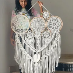 The beauty of macrame is in its versatility. We created this large, all-white cluster dreamcatcher to be a fusion of intricate artistry and bohemian charm, promising to infuse warmth and elegant style into any room it graces.
