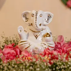 Simplicity holds its own divinity. This porcelain Ganesha, with delicate gold-painted details and the sacred 'Om' symbol, offers a moment of quiet reflection and peace.