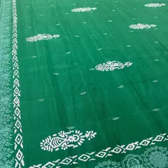A beautiful emerald green saree gets a makeover with our custom block prints. The traditional paisley and geometric patterns give it a completely new and fresh look.