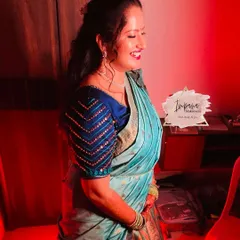 A happy bride during her Mehendi ceremony. I created a fun, vibrant look with a cut-crease eye to match the festive mood.