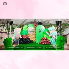 A full stage view of the Minecraft party, showcasing the character cutouts and the block-inspired balloon arrangement.