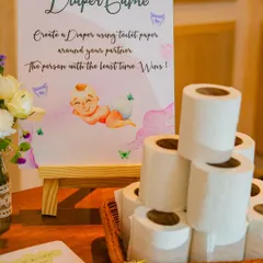 The 'Diaper Game' is a classic for a reason. I provide a beautifully designed sign and all the materials needed for this hilarious activity where guests race to create a diaper around their partner.
