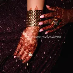 A stylish shot of the developed henna stain, paired with a beautiful cuff bracelet. My henna looks great with all your bridal accessories.