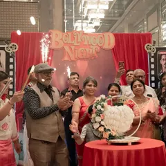 The joy and excitement during the cake cutting at the Bollywood-themed 60th birthday. Creating these peak moments of celebration is what event planning is all about.