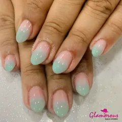 A soft and subtle color melt. This beautiful ombre design features a seamless blend from a natural, sheer pink to a fresh, minty green.