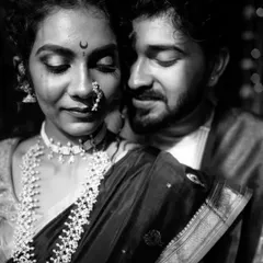 A stunningly intimate black and white close-up of a Maharashtrian couple, their eyes closed in a moment of quiet connection.