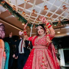 The bride's ecstatic expression as she dances her way in under the 'phoolon ki chadar'. Capturing this pure happiness is what my work is all about.