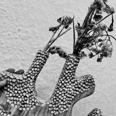 A black and white shot of the textured vase, highlighting the intricate carving and unique form. Hand-building allows for so much creative freedom.