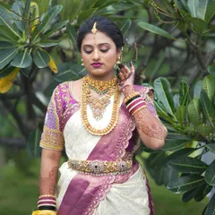 A full-length portrait of bride Pooja, looking serene and elegant on her wedding day.