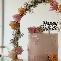 For a dreamy and elegant birthday, I created this beautiful cake with a tiara-like arch of fresh roses and baby's breath. The soft pastel pink ombre and delicate textures make it a truly special celebration cake.