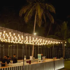 A custom-designed bar for a reception, featuring unique glass lighting and a sleek, modern design. Functional elements of your wedding can also be beautiful and stylish.
