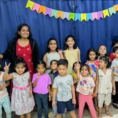 A happy moment from our 'Totally Booktastic Club'. Here, older children build confidence by reading their favorite stories to an eager audience of younger kids, creating a beautiful community of readers and storytellers.