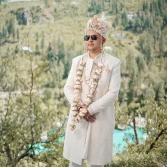 A groom stands against the stunning backdrop of the Jubbal valley. My goal is to make my portraits feel both personal and epic, integrating the character of the location.