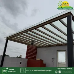 A closer look at the construction of our modern pergolas. The combination of a strong metal frame and translucent roofing creates a durable and elegant overhead structure that defines the outdoor space.
