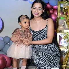 A beautiful mother and daughter moment captured at Kaina's tropical-themed birthday party. My goal is to create a backdrop that makes these photos timeless.
