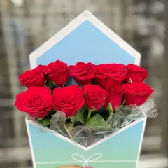 Our signature envelope box, filled with a dozen vibrant red roses. It's a modern and unforgettable way to send a message of love.