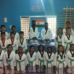 Another class photo with our students. You can see the different belt levels, from beginners to advanced, all training together.