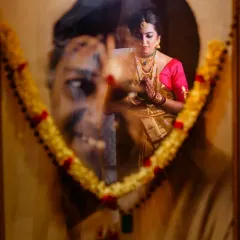 A deeply emotional and artistic shot. I used a double exposure technique to blend a portrait of a loved one with the bride, creating a poignant image that honors family members who are present in spirit.