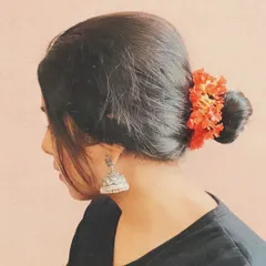 A simple, aesthetic photo showing my connection to my culture. Details like the flowers in my hair and traditional jhumkas are part of my artistic identity.