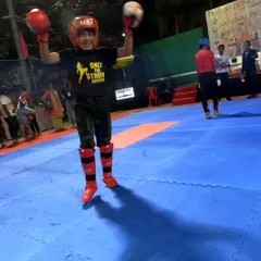 The pure joy of victory. Our youngest squad member, Erhaan Ansari, celebrates winning the Gold Medal at the National Kickboxing Championship.