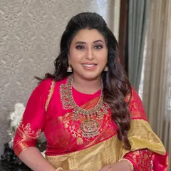 A simple yet elegant look for a family function, featuring soft waves and glowing skin.