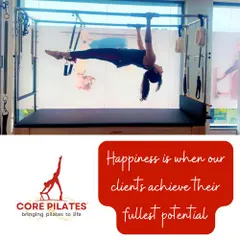 Happiness is when our clients achieve their fullest potential. This client demonstrates a full hanging extension, a testament to her core strength and control.