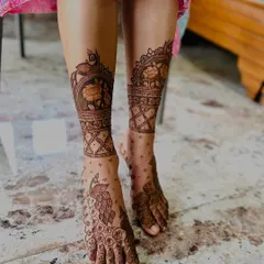 I believe mehndi should adorn you from head to toe. This traditional foot design features majestic peacocks and delicate jaali net patterns, ensuring your feet look as stunning as your hands for any festive occasion.