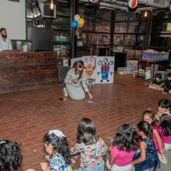 An instructor leads a group of young children in a building activity at a birthday party. We ensure that even the youngest guests are engaged with age-appropriate fun.