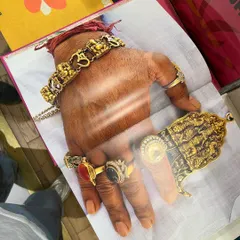Inspiration can come from anywhere. This photo from a book shows a hand adorned with incredible, heavy gold jewelry, including ornate rings and a massive bracelet. This kind of maximalist, traditional Indian design is a huge influence on my work.