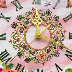 A detailed close-up of a 14-inch wall clock, highlighting the intricate floral mandala design at the center. The combination of fine-line painting and sculpted textures creates a truly luxurious feel.