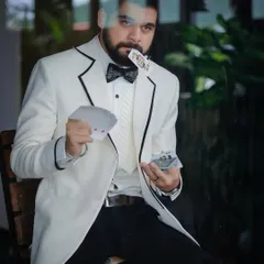 This playful shot with cards adds a layer of personality to the formalwear shoot with Kshitish Date.