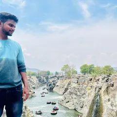 Taking in the panoramic view of Hogenakkal Falls. You can see the numerous coracle boats that take visitors for rides along the Kaveri river.