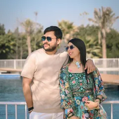 The couple looking cool and relaxed during their poolside Mehandi party. This is modern wedding photography at its best, casual and full of personality.