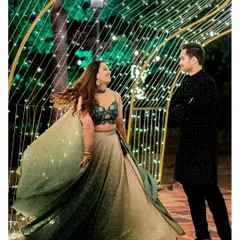 A magical twirl under a tunnel of fairy lights. We use creative lighting to make your Sangeet and Cocktail party photos look enchanting.