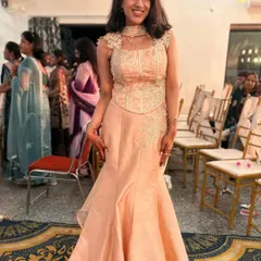 One of my lovely clients looking gorgeous in a custom-fitted peach fish-cut lehenga. The outfit features a structured corset top with delicate floral embroidery.