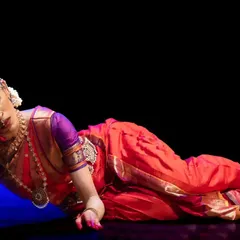 A posture of deep sorrow and longing from 'Abhilasha'. The performance explores the intense emotions of separation, or 'viraha', experienced by Radha.