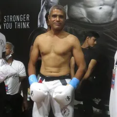 Master Ashwin Naidu, ready for his WKN kickboxing title fight. As instructors, we lead by example, continuously testing our skills at the highest levels of competition.