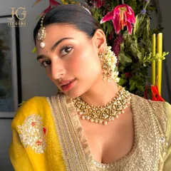 The regal allure of Polki is undeniable. Here, the beautiful Athiya Shetty embodies timeless elegance, adorned in our handcrafted Polki necklace set with delicate pearls, showcasing a rich heritage of Indian craftsmanship.
