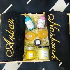 I just love this black and gold theme for a modern couple. This wedding hamper includes luxurious black towels with gold embroidery, initial soaps, and a selection of my colorful, homemade bath products in a wooden tray.