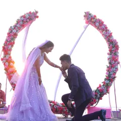 A beautiful beachside proposal with a stunning floral arch. We help you plan and capture these once-in-a-lifetime moments, ensuring your engagement photos are as breathtaking as the proposal itself.