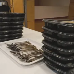 Stacks of our packed meal containers ready for a large catering order. We ensure every meal is packed hygienically and is easy to transport and serve.