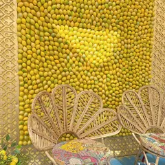 The bride's seating area featured a stunning backdrop made entirely of fresh lemons, creating a fragrant and visually impactful photo wall. The peacock-style cane chair adds a touch of bohemian chic.