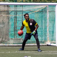 A goalkeeper stands ready between the posts. My team includes experienced players and coaches who understand every aspect of the game.