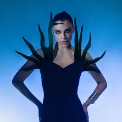 This shot is from a futuristic fashion series, where I played with colored gels and hard lighting to sculpt the model's form. It demonstrates my technical skill in creating a high-impact, otherworldly mood for cutting-edge brands.