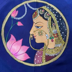 A still image of the completed Rajasthani queen painting, showing the fine lines, delicate jewelry details, and rich color palette on a deep blue fabric.