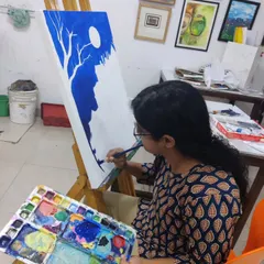 The initial stages of a monochromatic landscape, where the student blocks in the main shapes of the composition using deep blue acrylic paint.