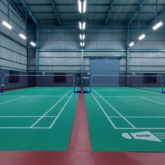 The four badminton courts are housed within a 38-foot high pre-engineered building (PEB) shed, providing ample vertical space for the game.