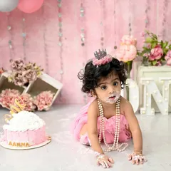 The pure, messy joy of a first birthday cake smash! This little princess is having the time of her life exploring her first taste of cake. These sessions are all about capturing candid happiness and personality.