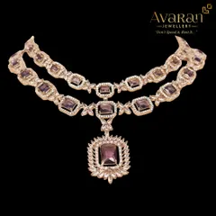 A modern and elegant layered necklace with purple stones and sparkling zircons. This piece is perfect for a reception or cocktail party, adding a touch of color and sophistication to your look.