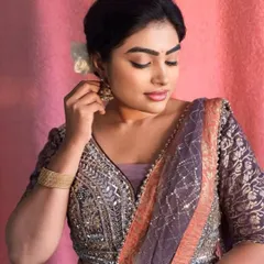A soft glam look, perfect for a wedding reception or special event. The focus here is on flawless skin, defined eyes, and a subtle lip, paired with an elegant lehenga.